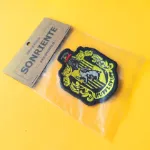 Parche de la insignia de Hufflepuff de la película Harry Potter vista detalle