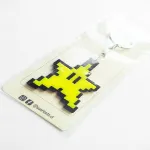 llavero de la estrella de super mario bros vista detalles